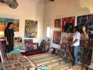 behind the scenes photo, artist speaks in gallery space
