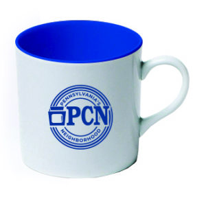 white mug with blue interior and blue PA's Neighborhood logo